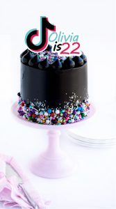 black cake with topper